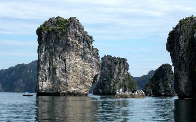 Limestone karsts rising from the water in Ha Long Bay, Vietnam