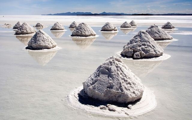 Cones of harvested salt on the Salar de Uyuni, Bolivia