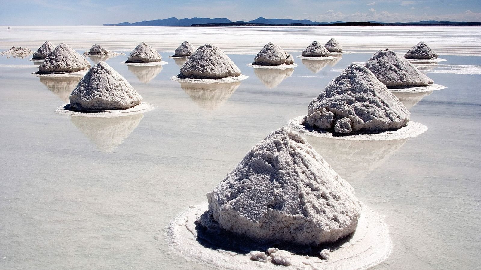Cones of harvested salt on the Salar de Uyuni, Bolivia