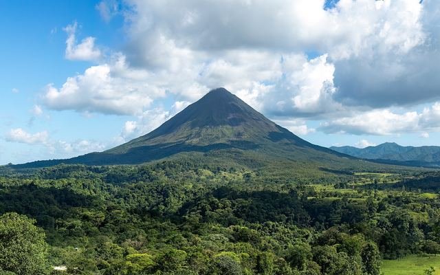 Arenal Volcano rising above rainforest, Costa Rica